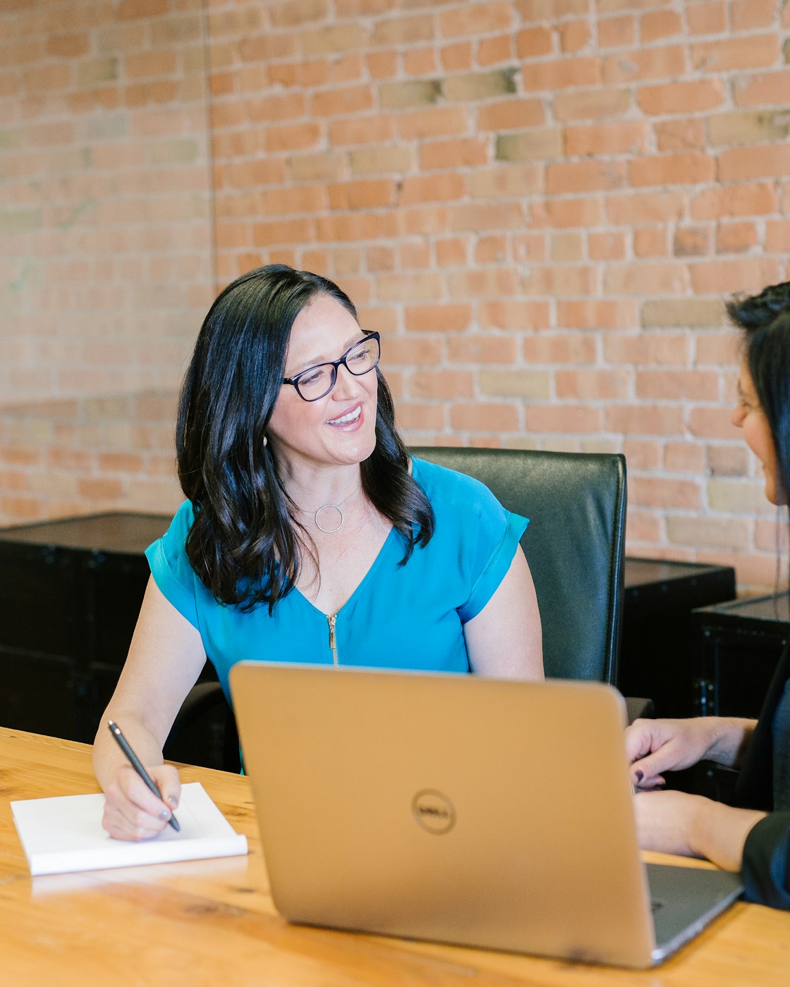 Recruitment consultant discussing requirements with a candidate during a meeting